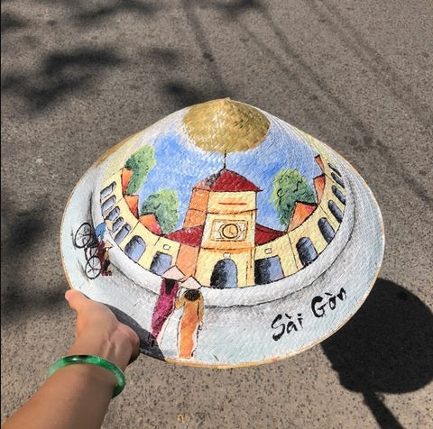 Palm leaf hat painted with famous landmarks