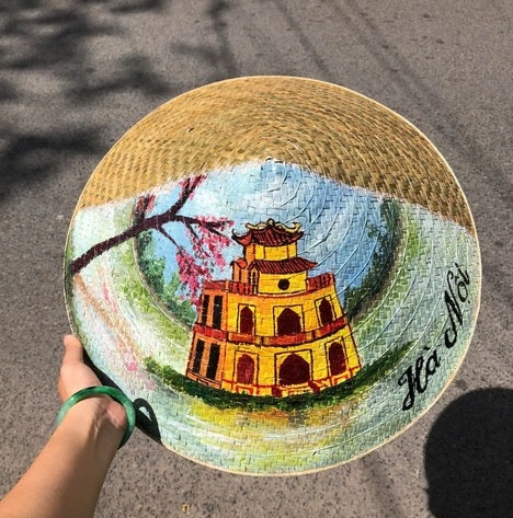 Palm leaf hat painted with famous landmarks