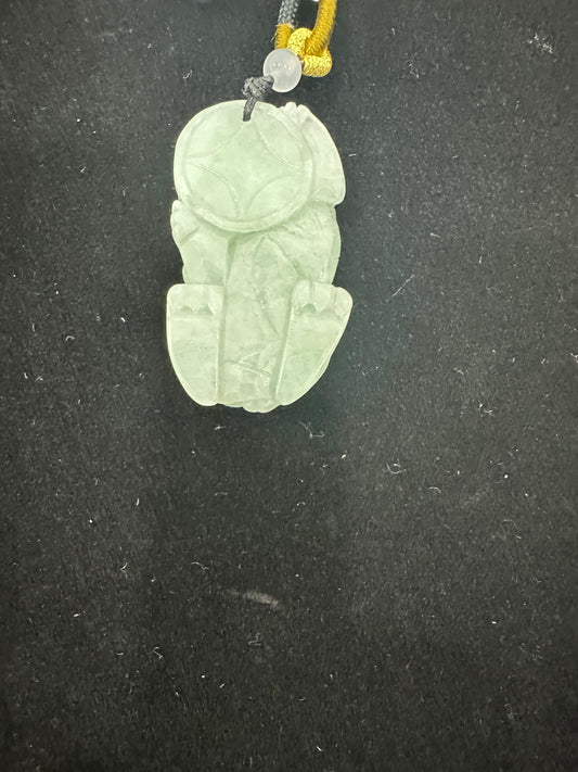 Jade pendant featuring a carved Pi Xiu (貔貅) desi