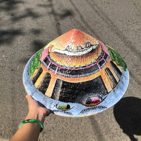 Palm leaf hat painted with famous landmarks
