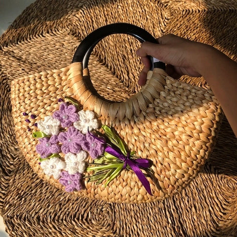 Hand embroidered water hyacinth handbag