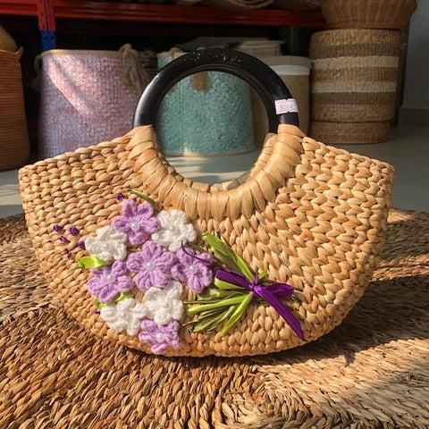 Hand embroidered water hyacinth handbag
