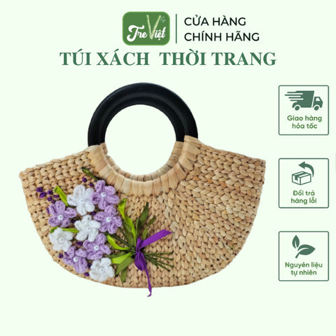 Hand embroidered water hyacinth handbag